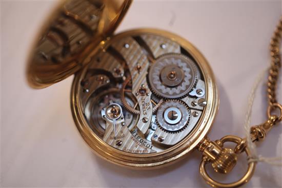 A George V 18ct gold Hamilton open face keyless lever pocket watch and an 9ct gold curblink albert,